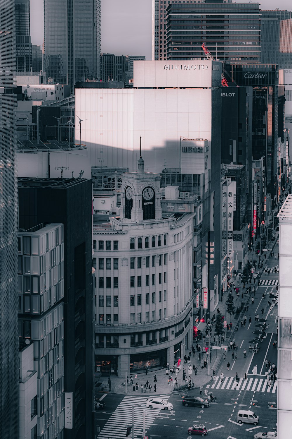 a view of a busy city street with tall buildings