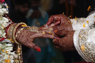 a close up of a person holding another person's hand