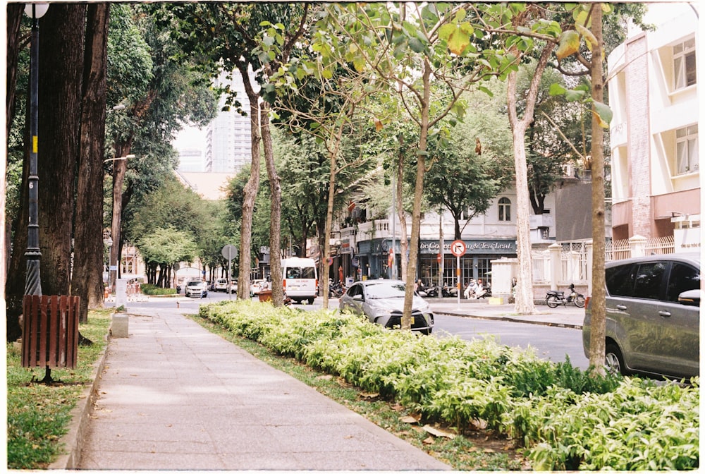 a city street with cars parked on the side of it