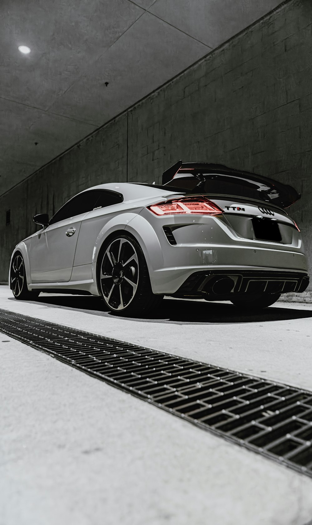 a silver car parked in a parking garage