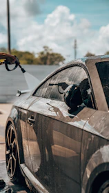 a car being washed with a car wash machine