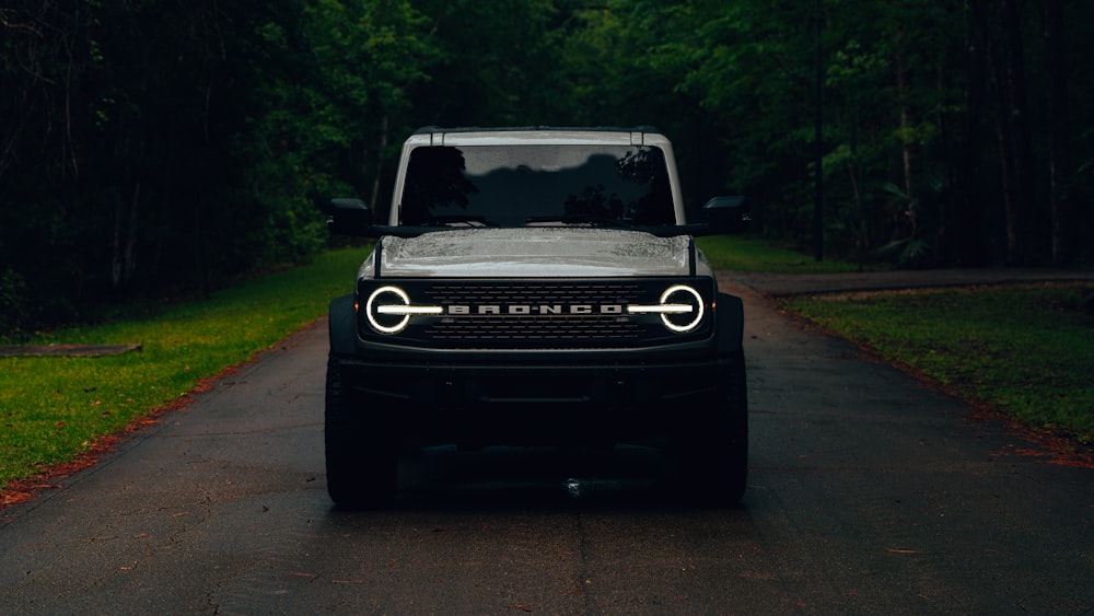 a black jeep is parked on the side of the road