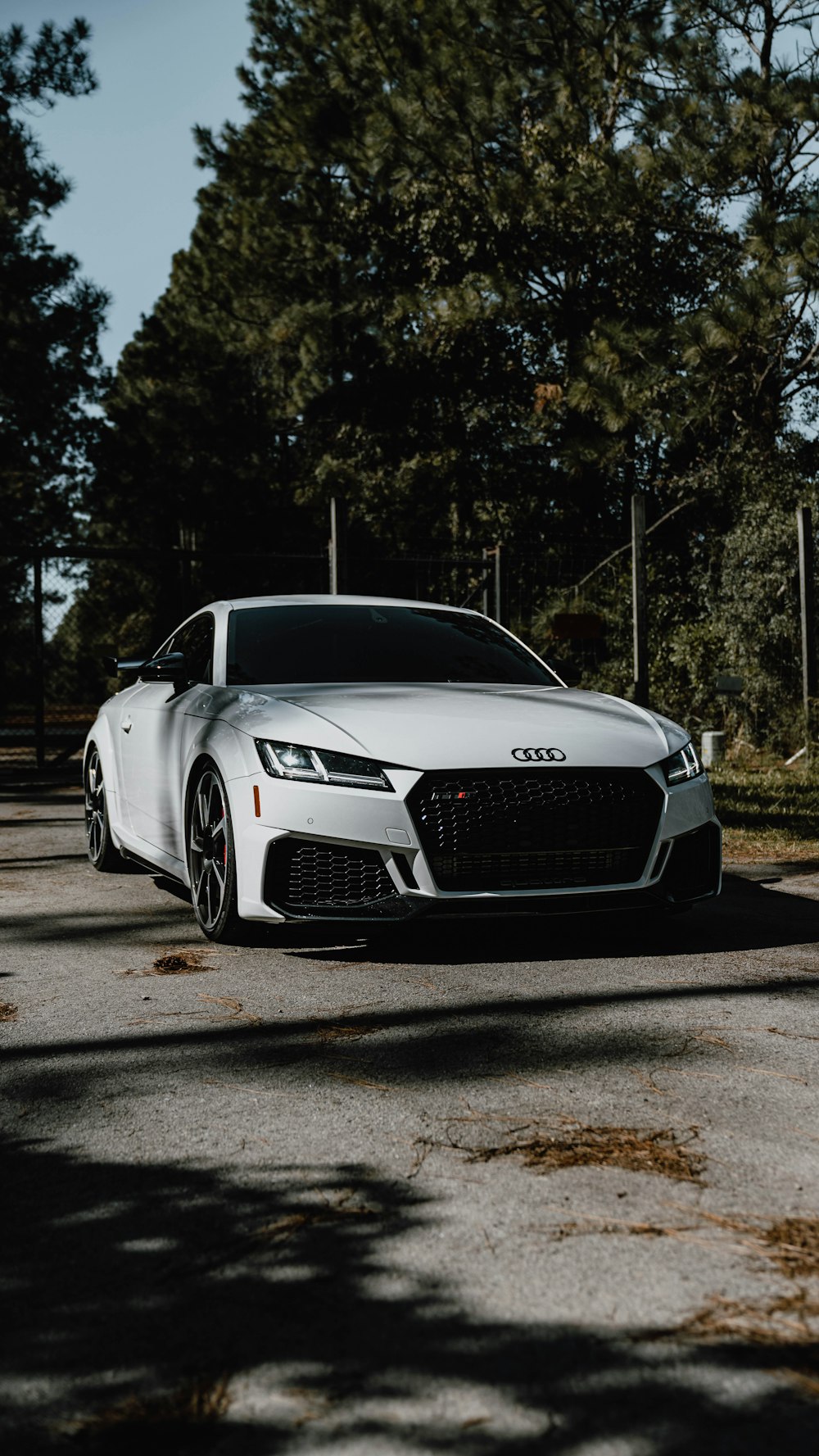 a white car parked on the side of the road