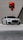 a white car parked in front of a building