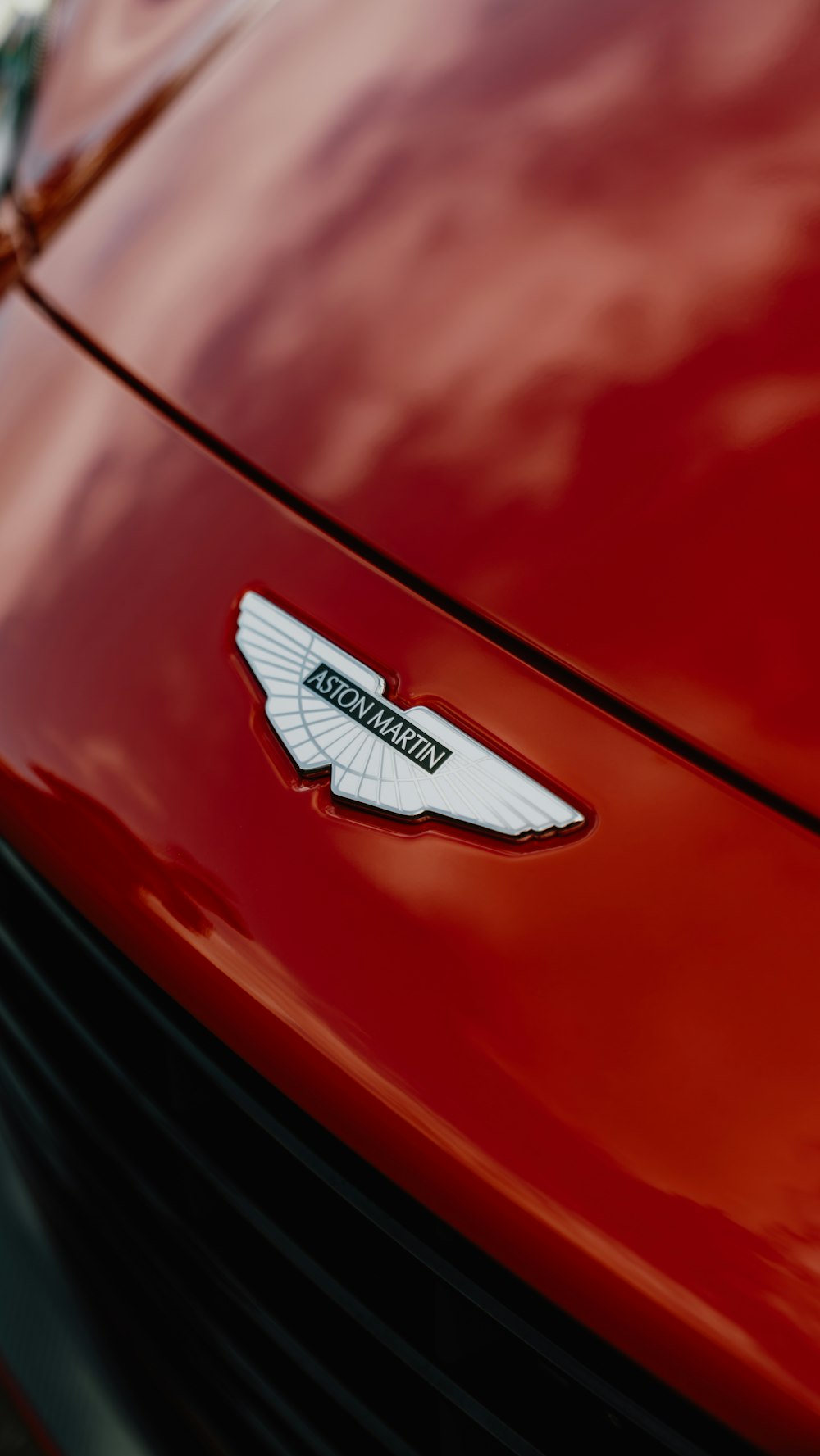 a close up of the emblem on a red car