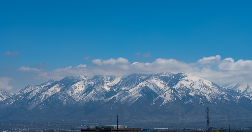 a view of a snowy mountain range from a distance