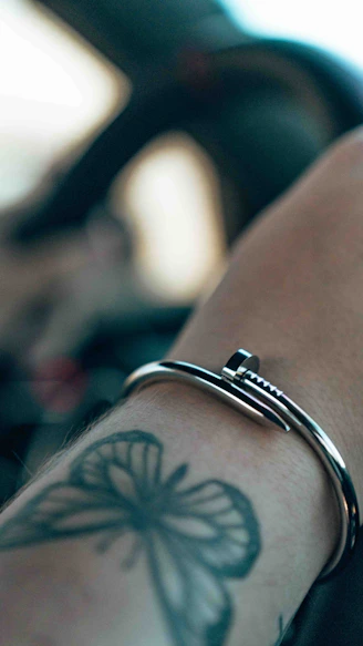 a close up of a person's arm with a tattoo on it