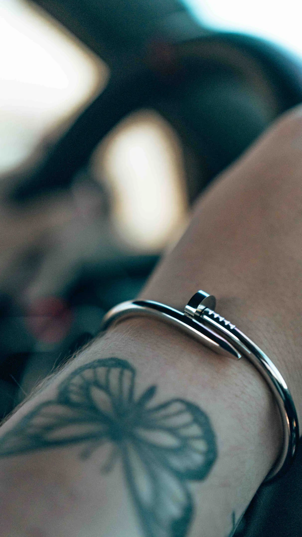 a close up of a person's arm with a tattoo on it