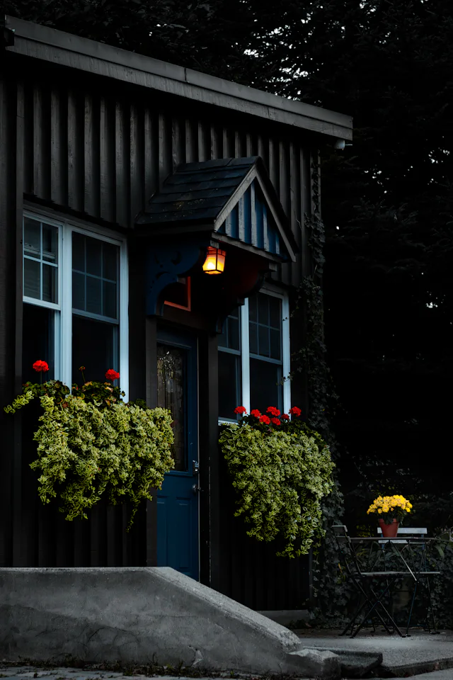Small residential house with a front yard typical of homes we service near Arlington, MA