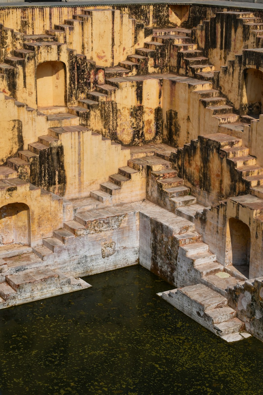 a very old building with some water in it