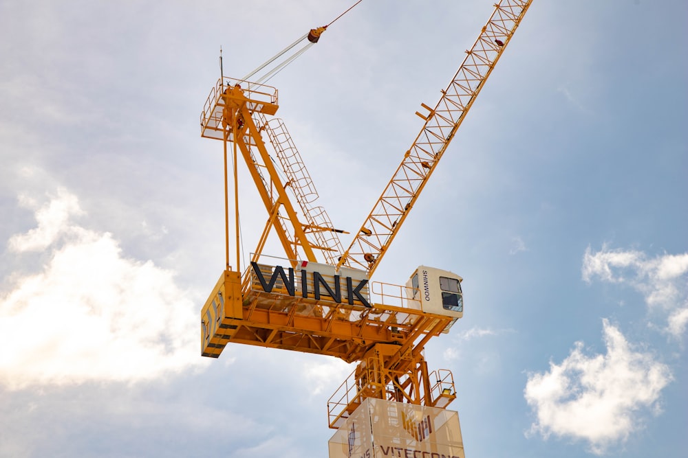 a yellow crane with the word winkink on it