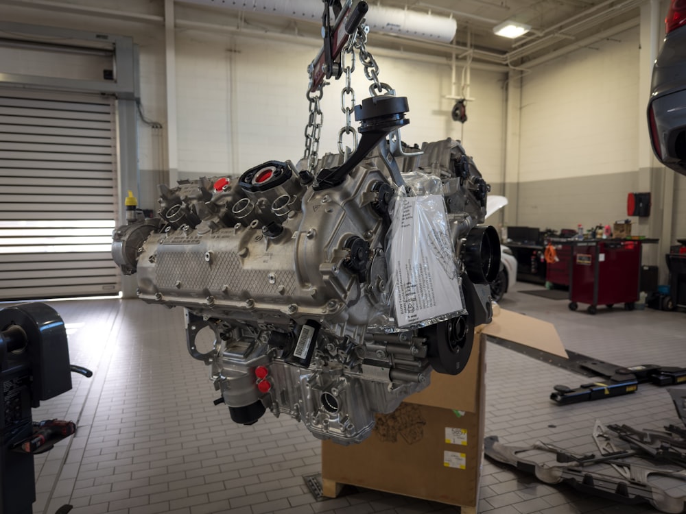 a car engine being worked on in a garage