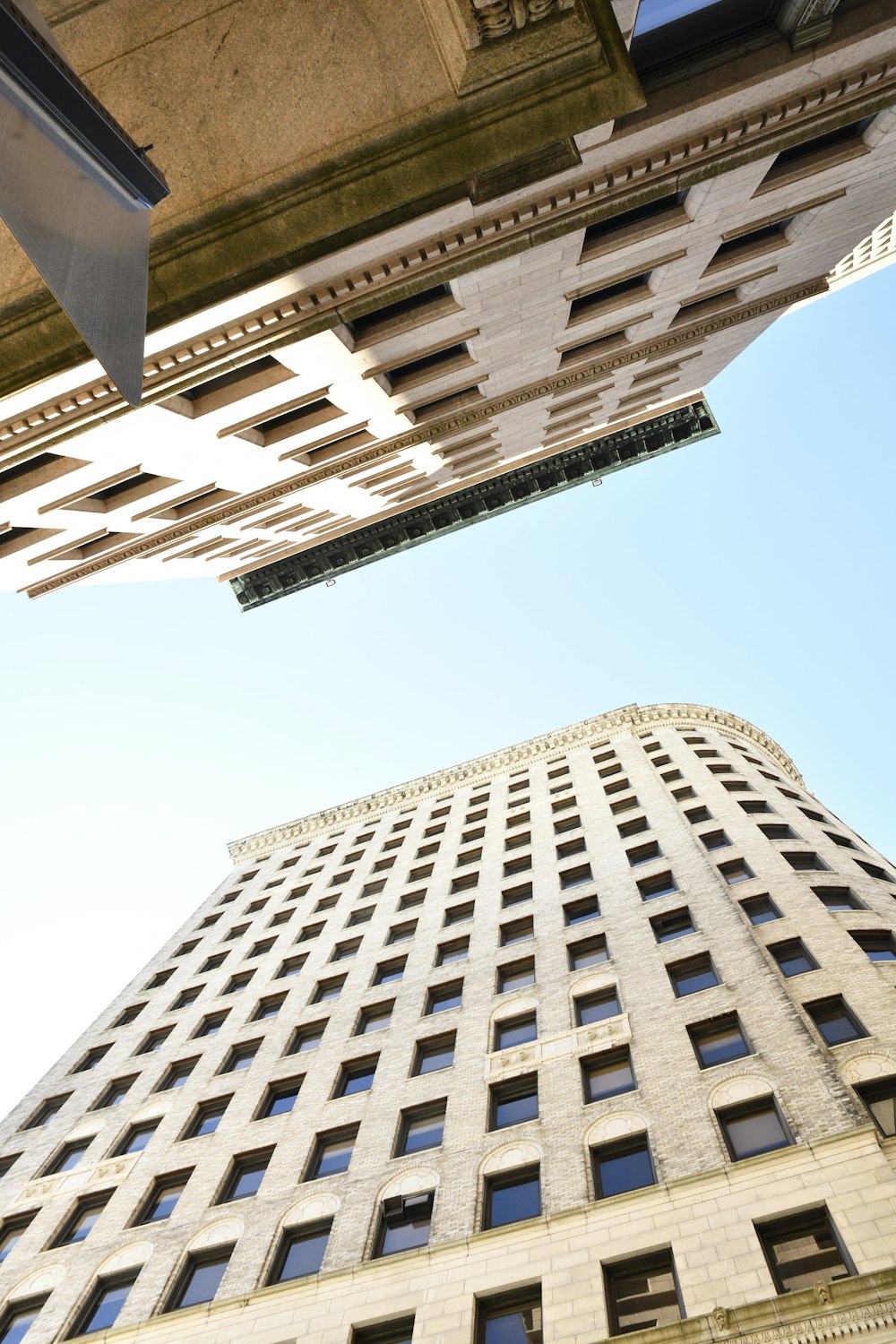 looking up at a tall building from the ground