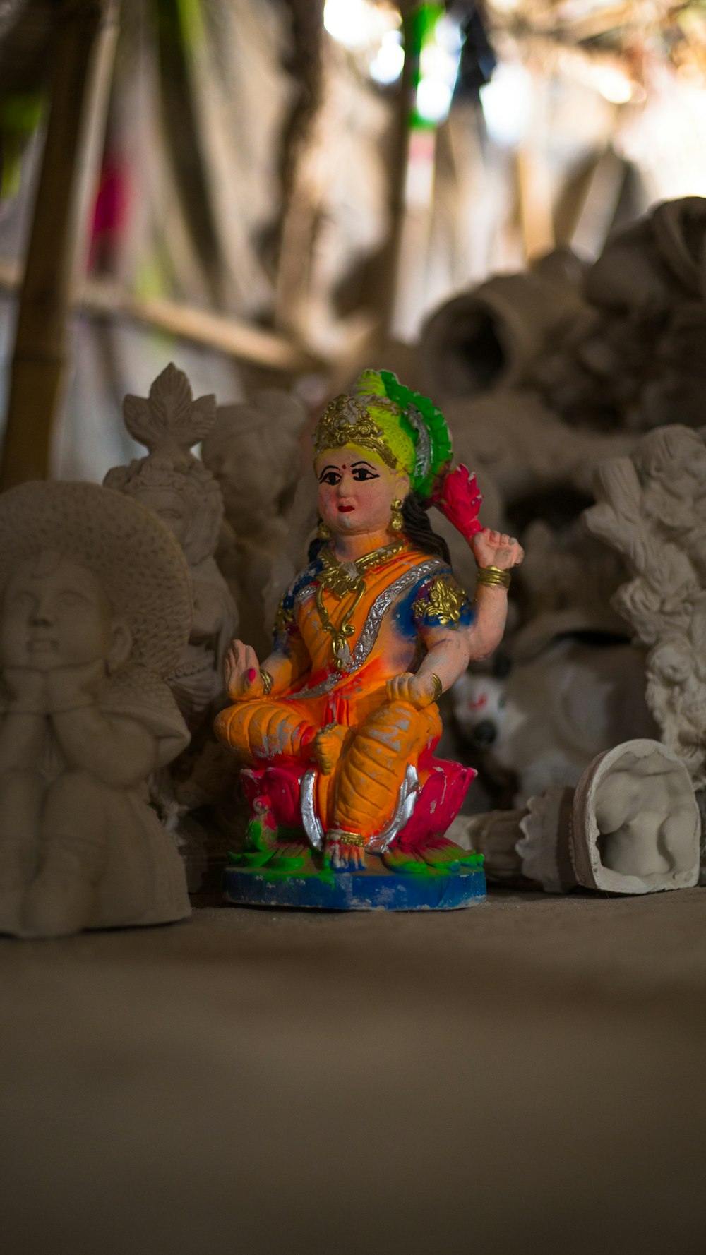 a small statue of a person sitting on a table