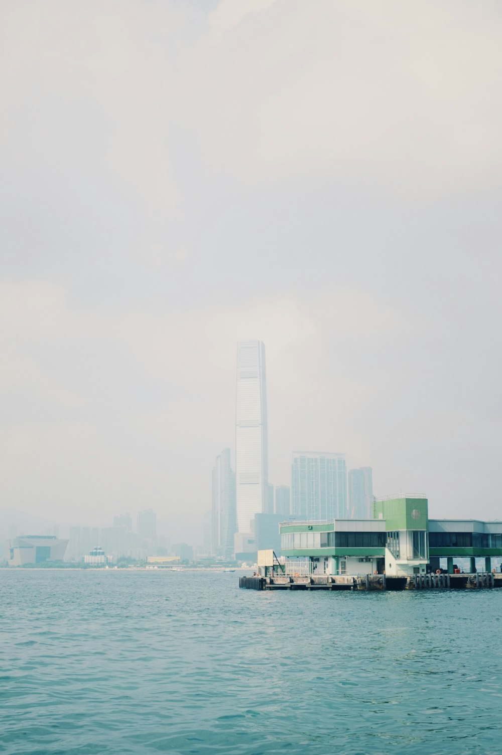 a large body of water with a city in the background