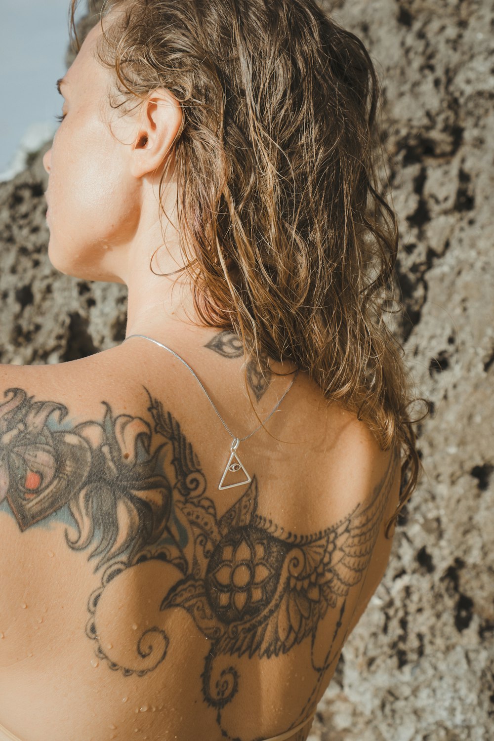 a woman with a tattoo on her back