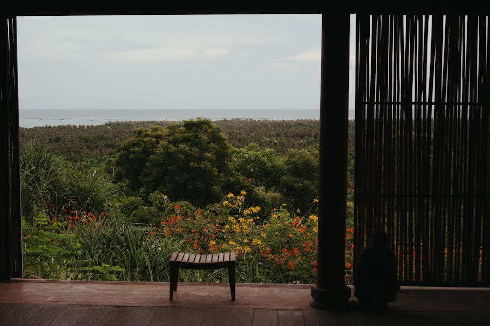 a wooden bench sitting on top of a wooden floor