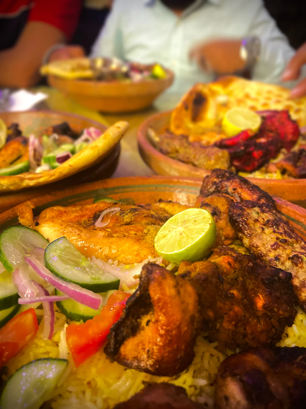 A Pakistani family meal spread with rice and chicken