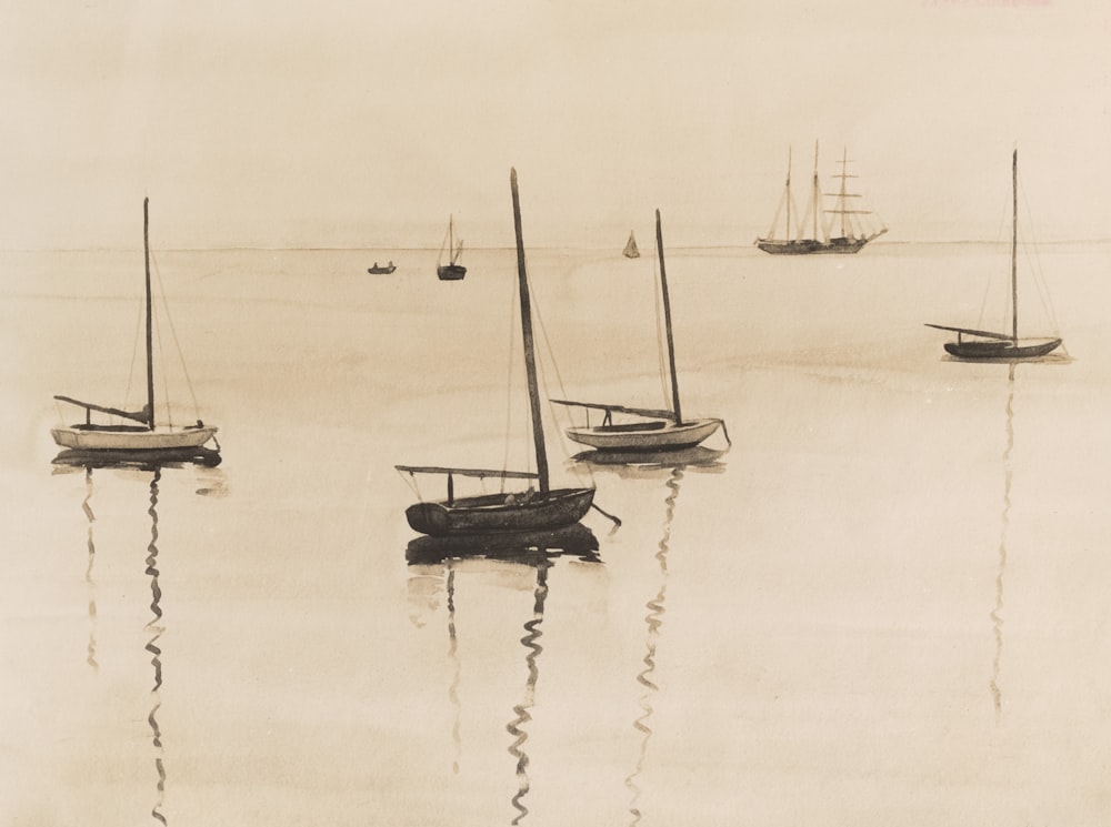 a group of boats floating on top of a body of water