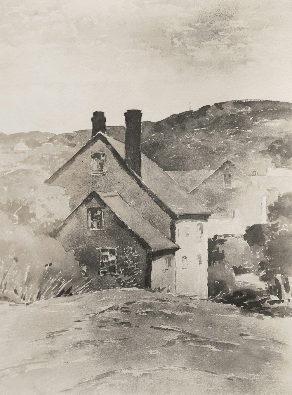 a black and white photo of a house on a hill