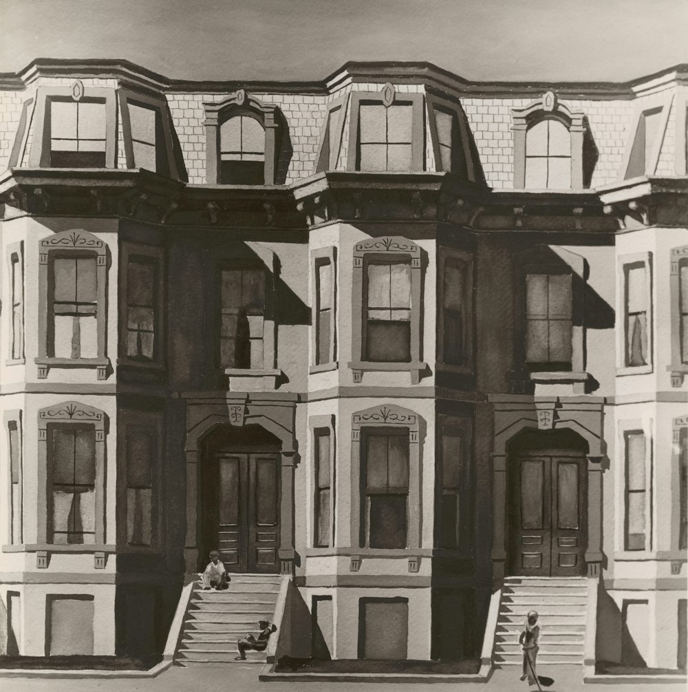 a black and white photo of a row of houses