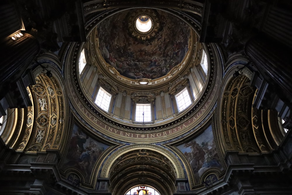 the ceiling of a church with a large painting on it