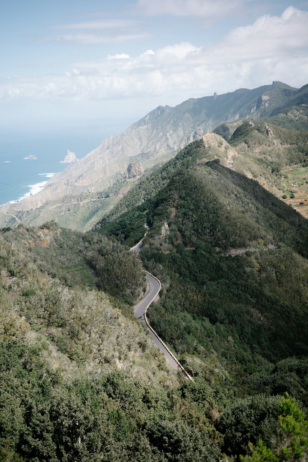 a winding road on the side of a mountain