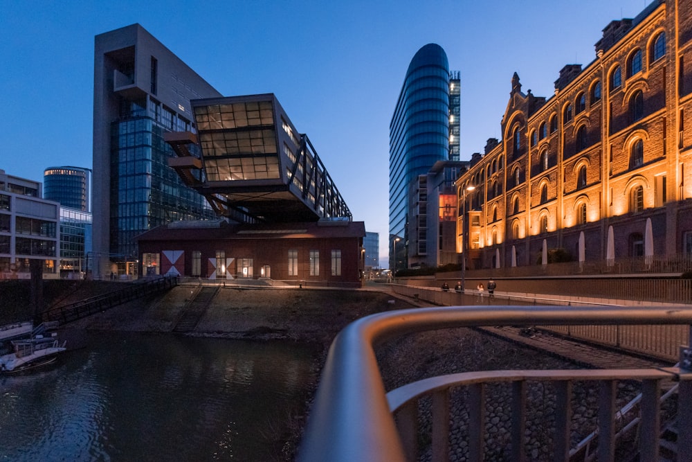 a river running through a city next to tall buildings