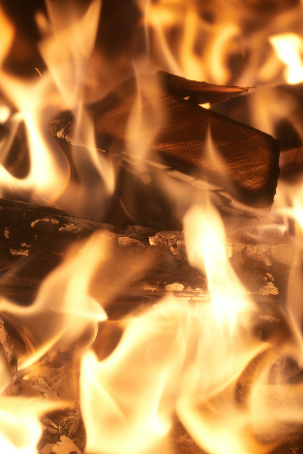 a close up of a fire with flames coming out of it