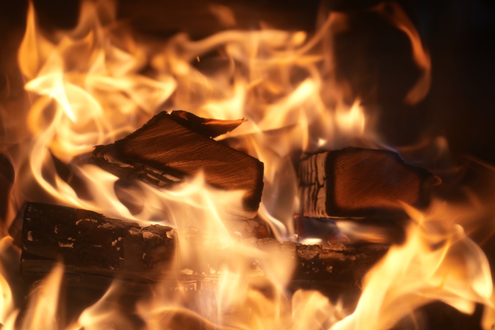 a close up of a fire burning in a fireplace