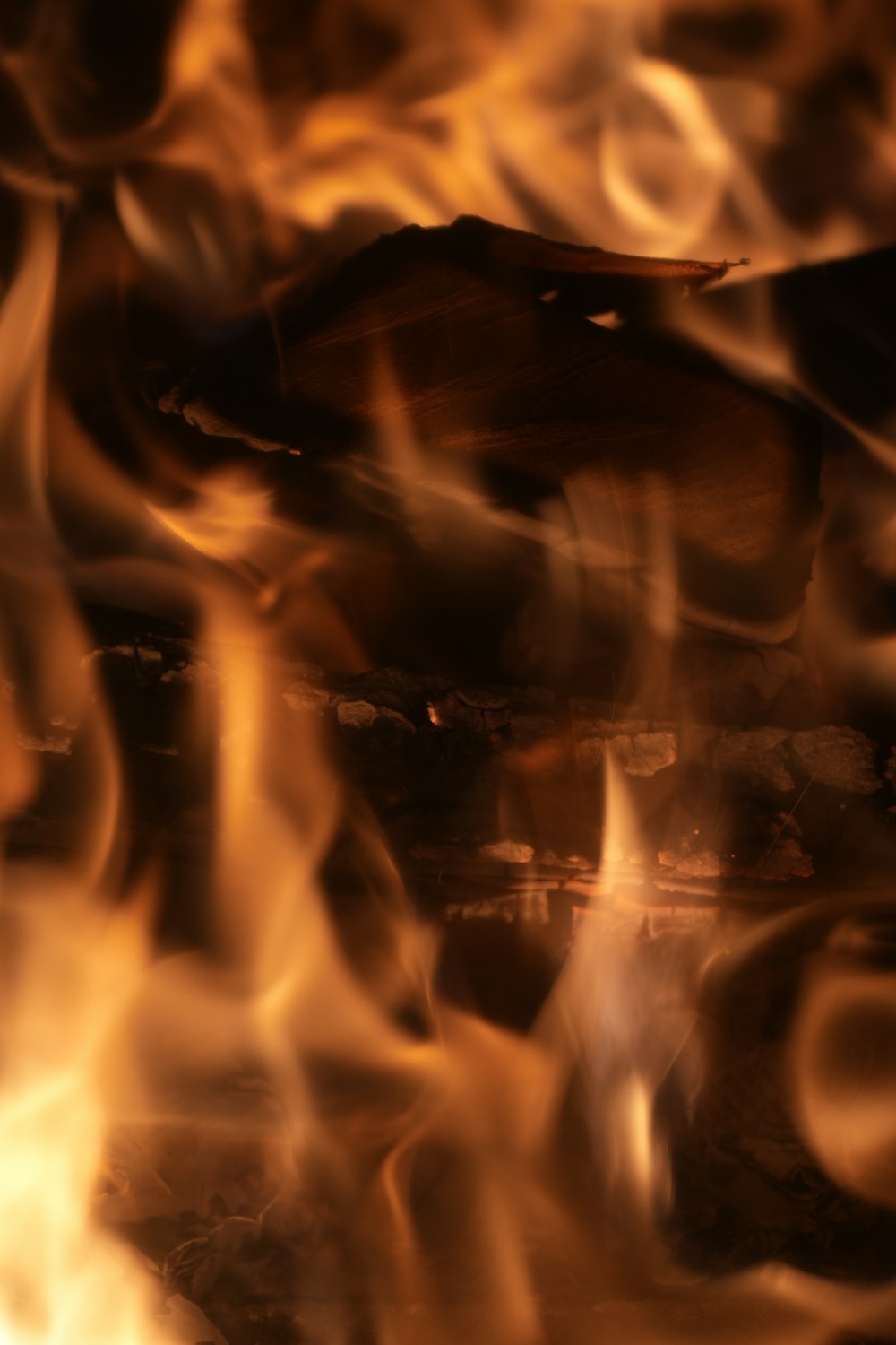 a close up of a fire with flames coming out of it