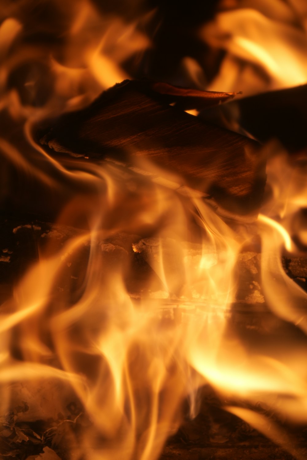 a close up of a fire burning in a fireplace