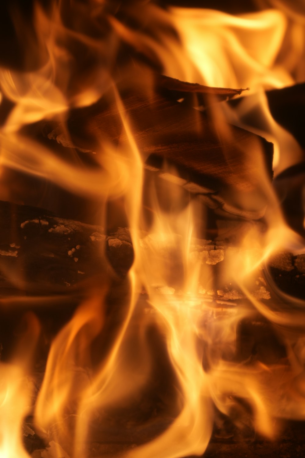 a close up of a fire burning in a fireplace