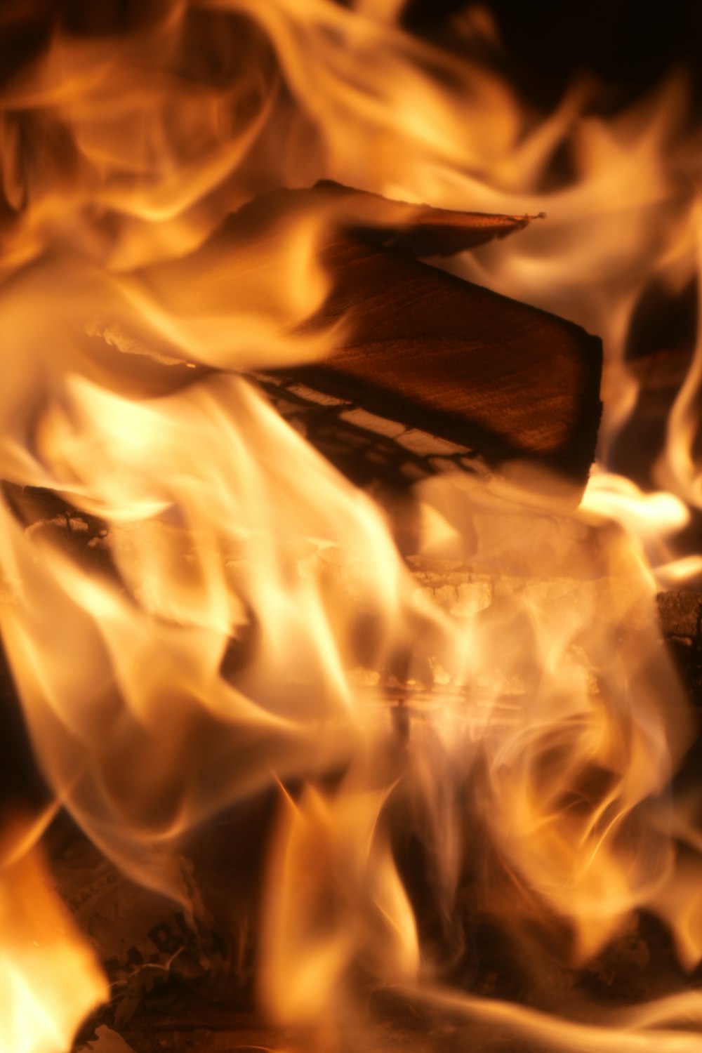 a close up of a fire with flames coming out of it