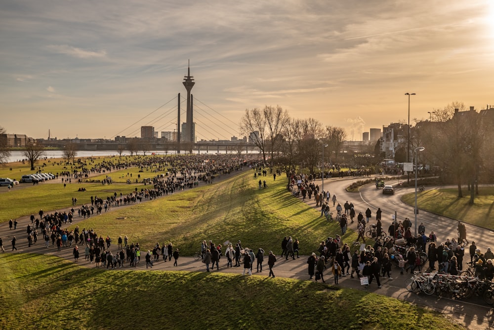 a large group of people walking down a street