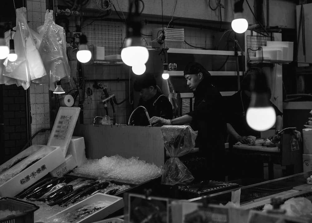 a man standing in a kitchen preparing food