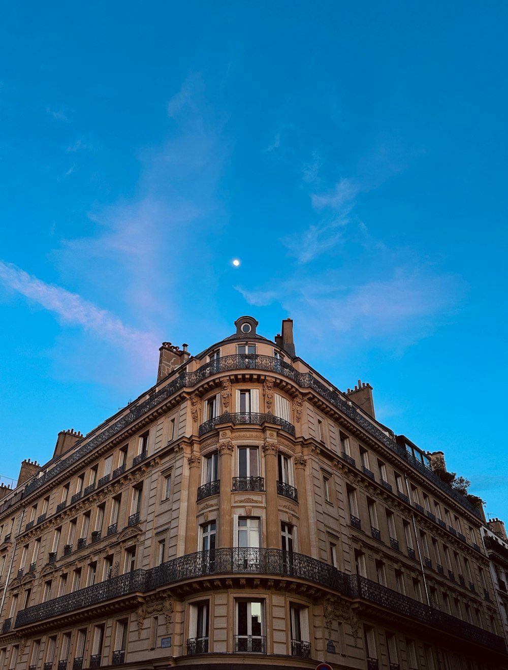 a tall building with a clock on the top of it