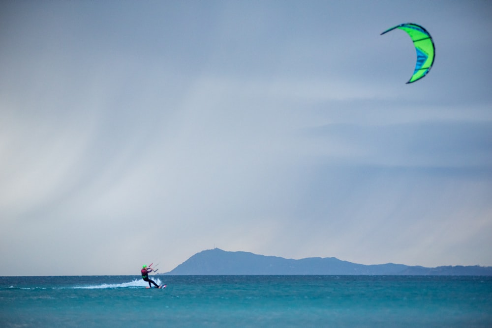 a person riding a surfboard on top of a body of water