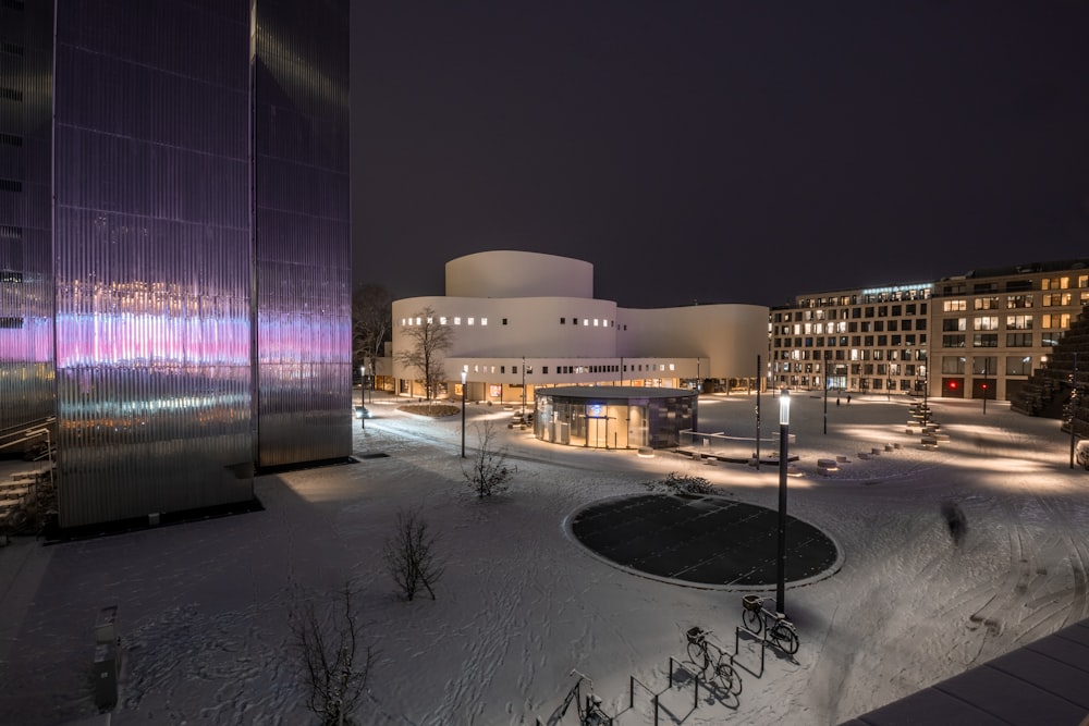 a night time view of a building with a lot of lights