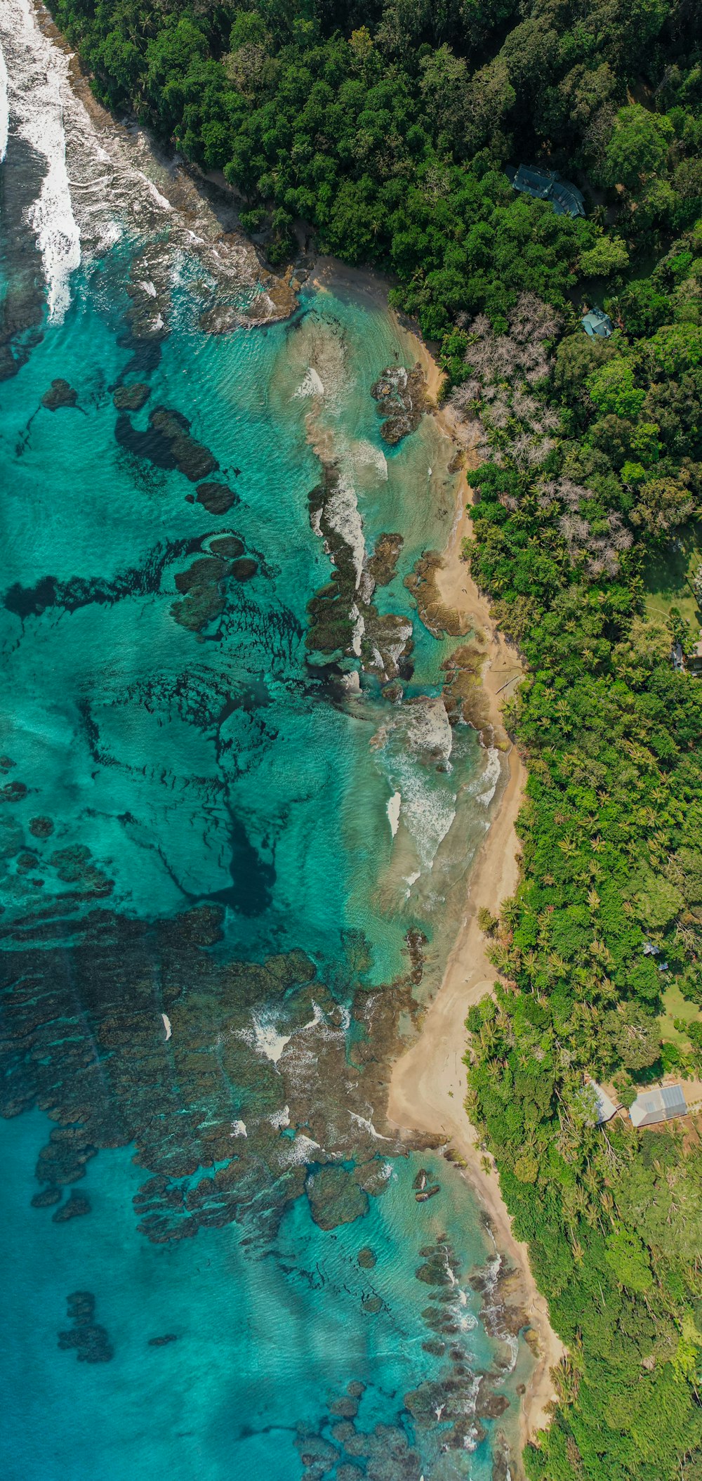 an aerial view of the ocean and land