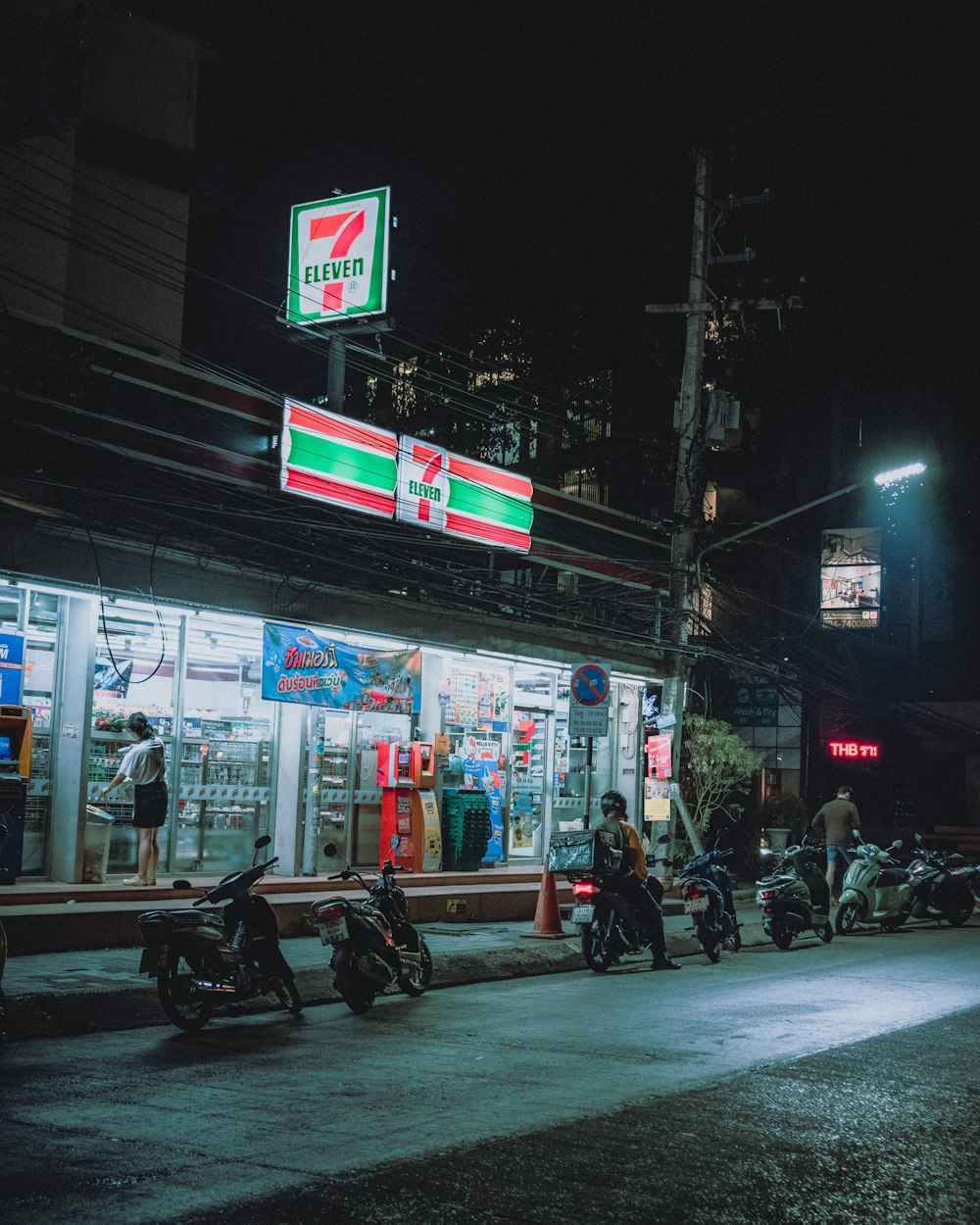 a group of motorcycles parked outside of a gas station