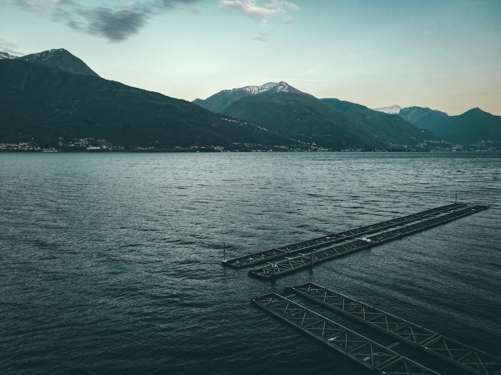 a large body of water with mountains in the background