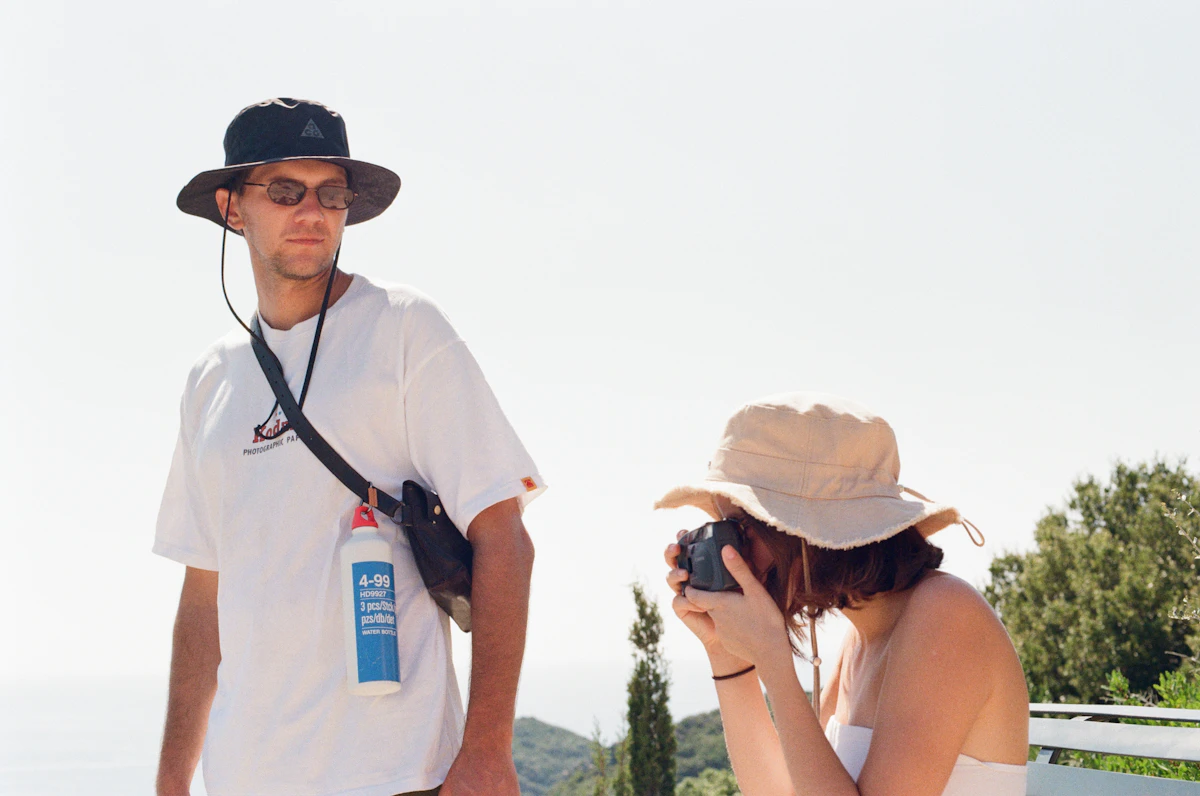 a man taking a picture of a woman with a camera