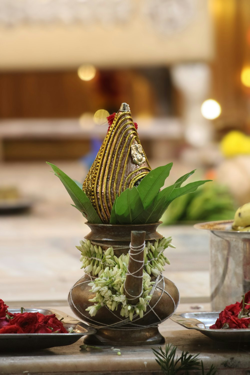 a vase filled with flowers sitting on top of a table