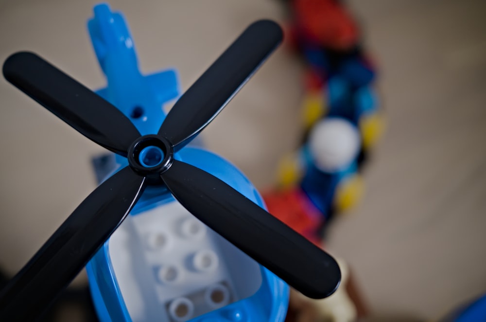 a close up of a toy propeller on a table