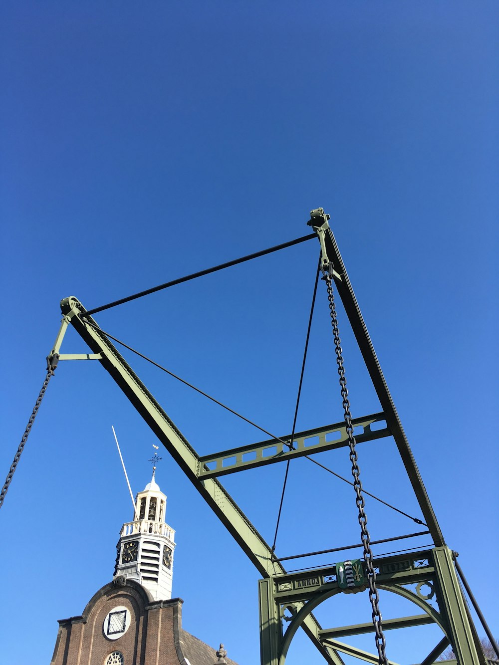 a large metal structure with a clock on it