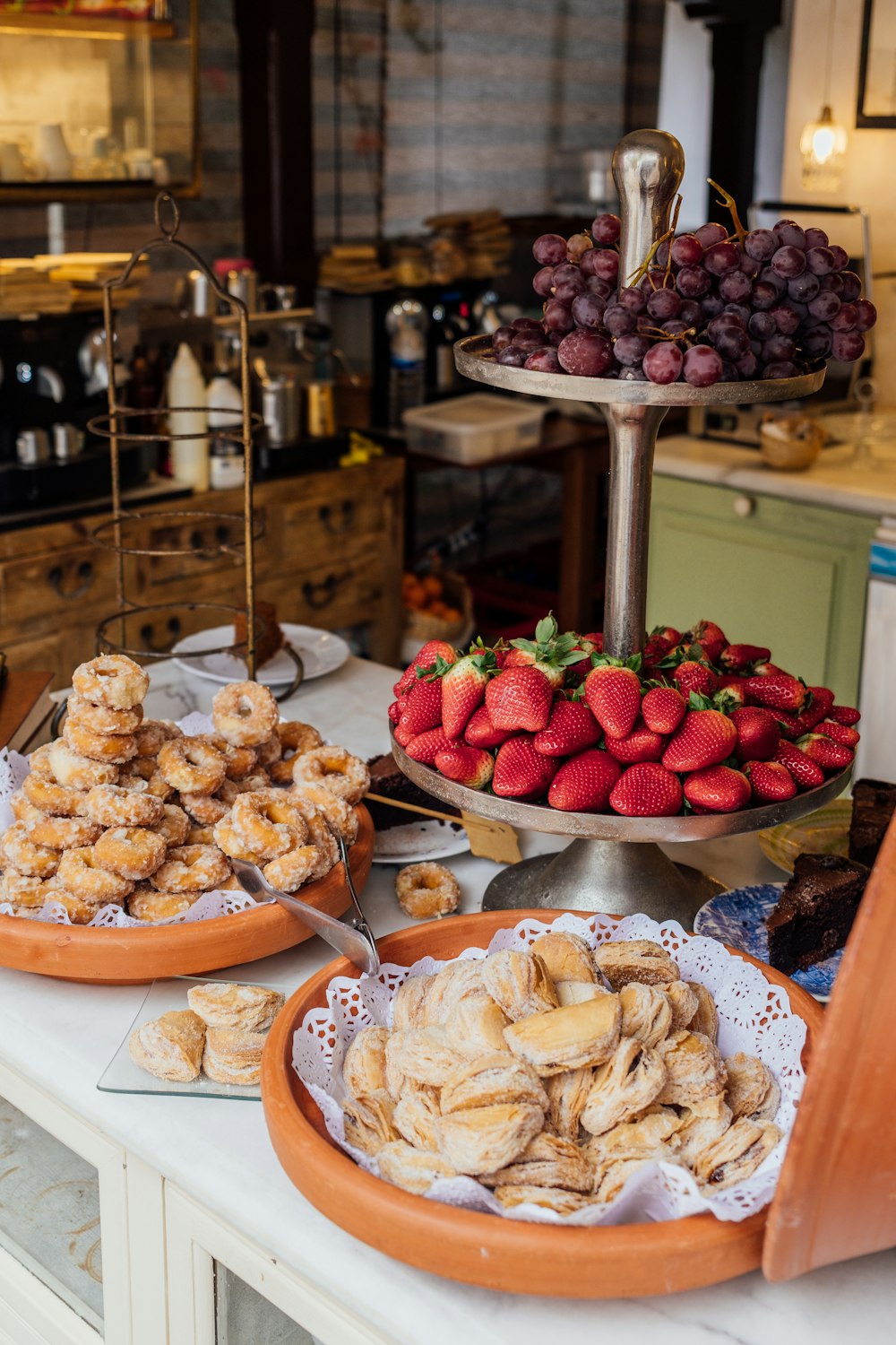 a variety of pastries are on display in a bakery