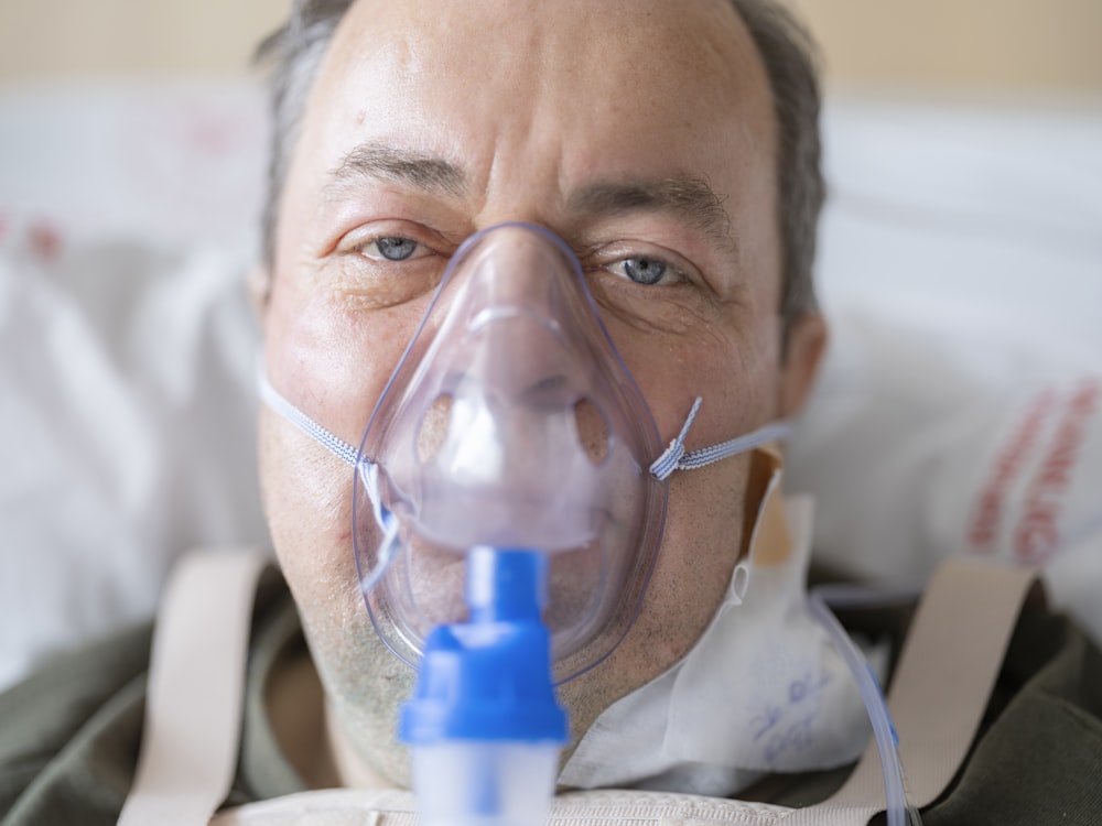 a man with a respirator on his face