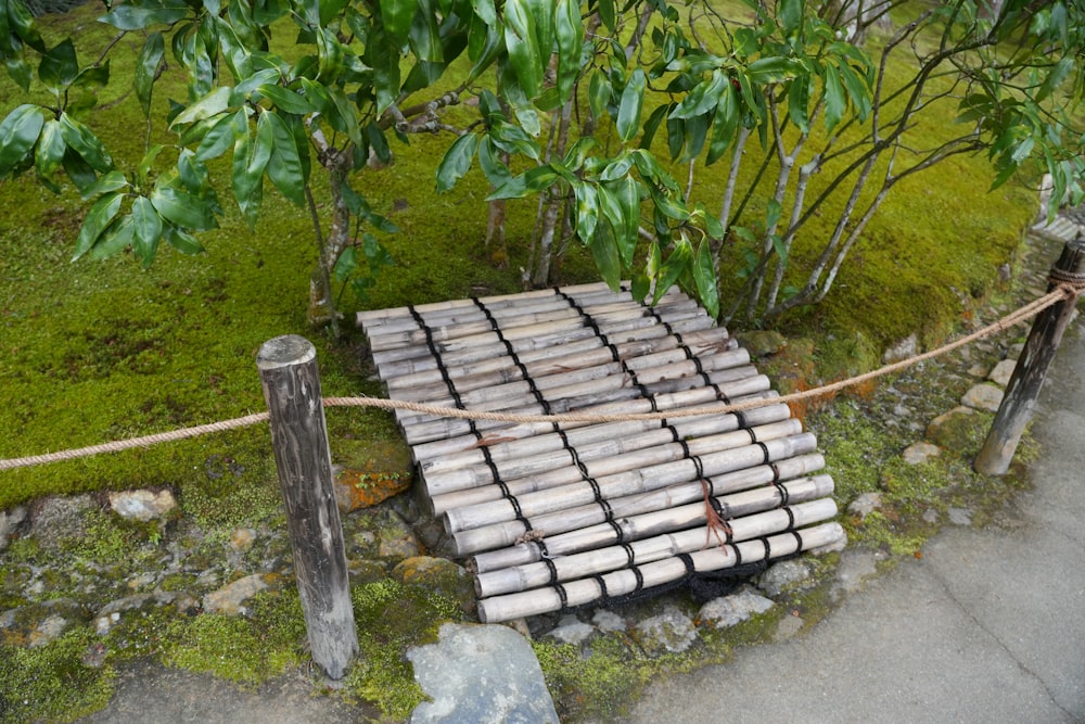 a pile of bricks sitting on top of a lush green field