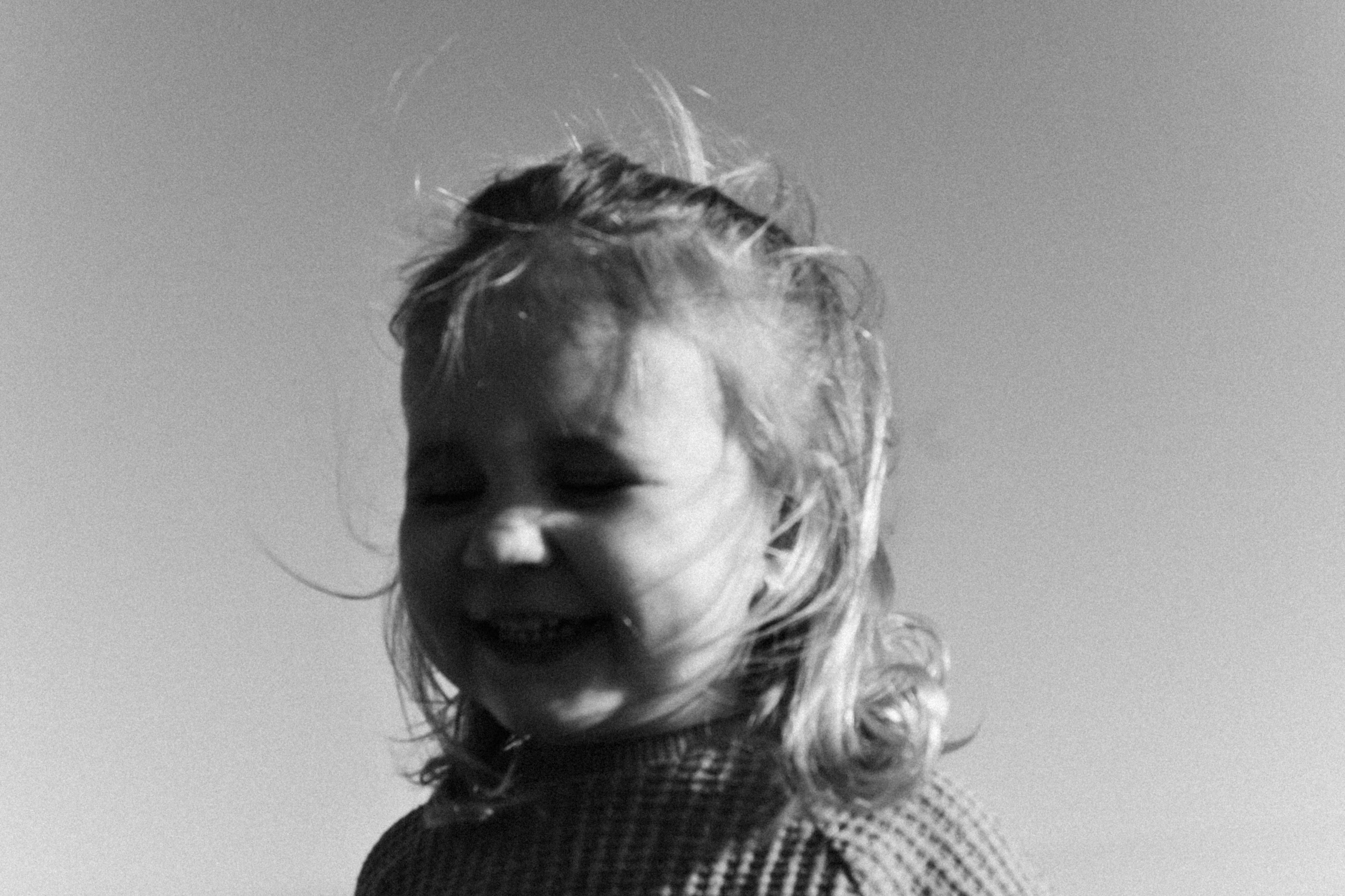 a little girl that is holding a frisbee